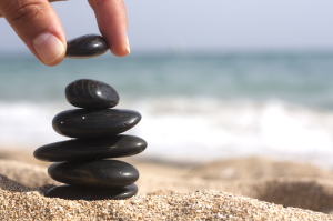 hand stacking rocks